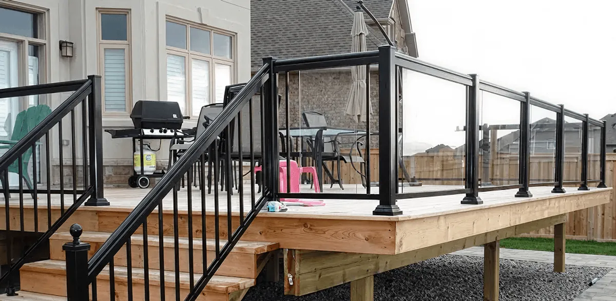 Handrail installation on a deck staircase for safety and code compliance in Aurora, CO